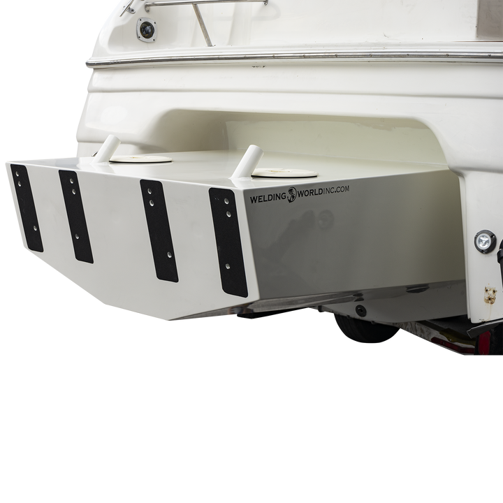 Close-up of a Regal Commodore 28 boat with a custom high flotation twin outboard engine bracket, showing a white, sturdy support structure attached to the stern. The bracket features black mounting plates with multiple holes and a reflective surface with the "Welding World Inc." logo and website. The background is transparent with a checkered pattern