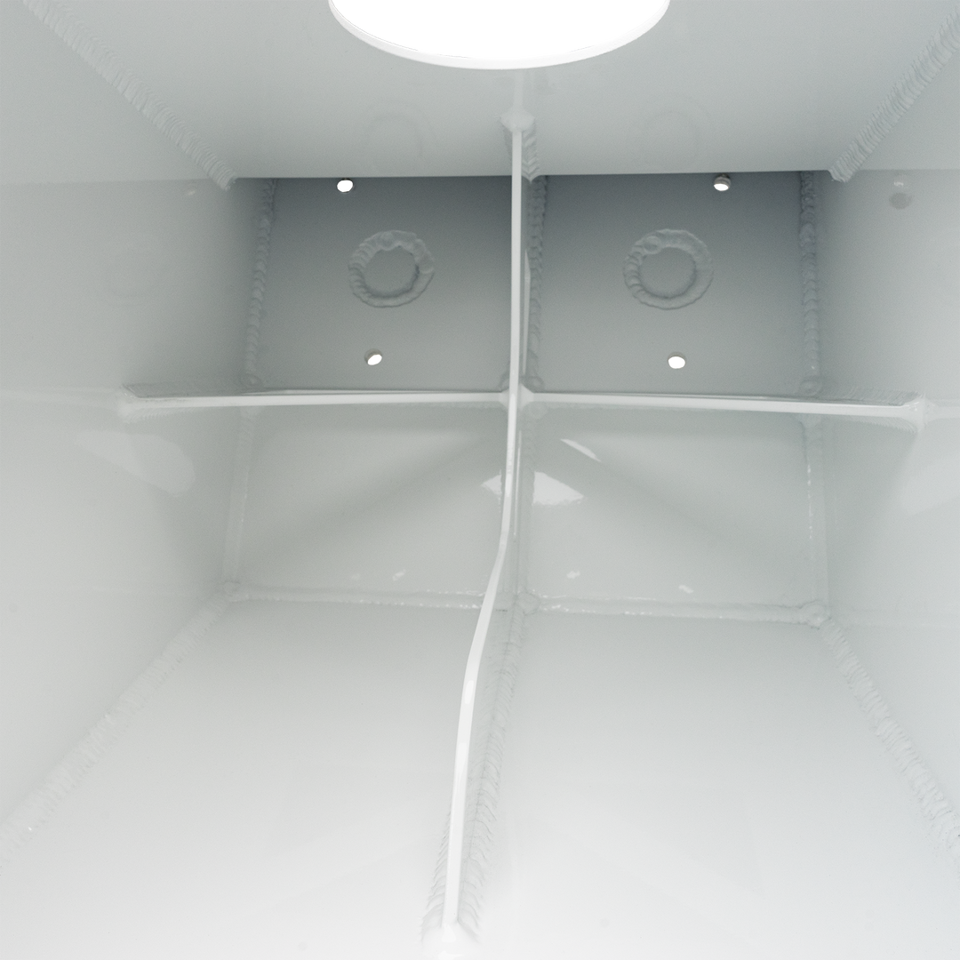 The interior of a white metal enclosure showing the Apex Mk. 2 NSP Single Engine Bracket, which is a white, rectangular component with rounded edges, featuring two circular holes and a central welded ring. The background is white with a black border and a checkered pattern at the top