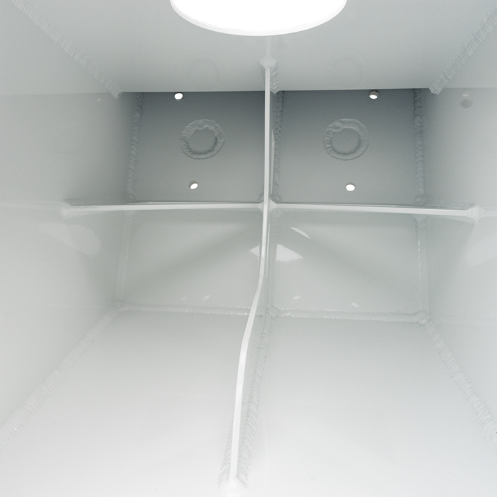 The interior of a white metal enclosure showing the Apex Mk. 2 NSP Single Engine Bracket, which is a white, rectangular component with rounded edges, featuring two circular holes and a central welded ring. The background is white with a black border and a checkered pattern at the top