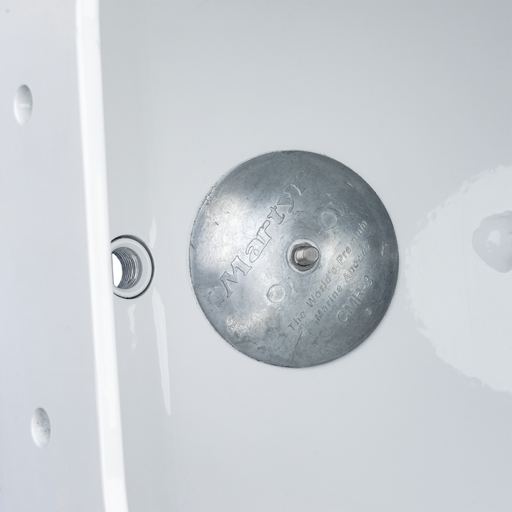 Alt text: A metallic Apex Mk. 2 NSP Single Engine Bracket with a circular shape, featuring engraved text and a central hole. Next to it is a smaller threaded component, both placed against a plain white background