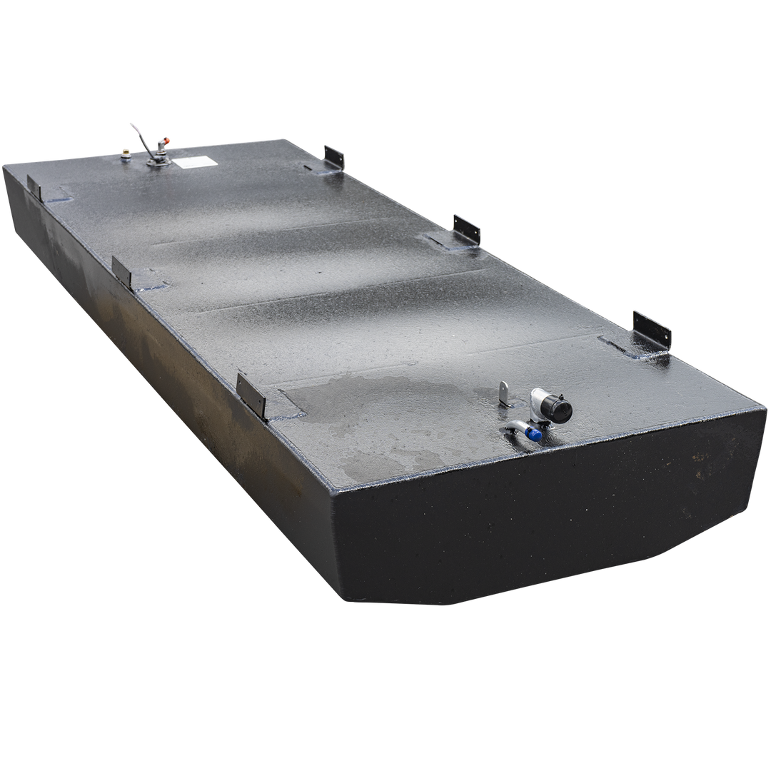 A long, rectangular, black fuel tank with a textured surface, shown from a slightly elevated perspective against a checkered background. It has several L-shaped mounting brackets along its top edges. Various fittings and ports are visible on its top surface, including a hose with a blue cap, a small post, a sensor with a red cap and exposed wires, and a small white label. The bottom of the tank has a curved, tapered shape