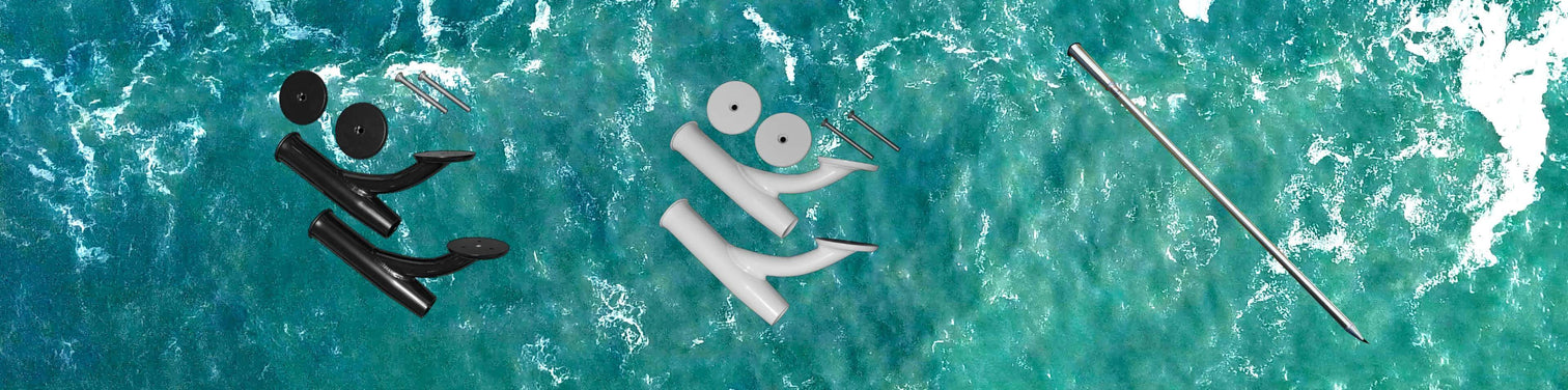 An aerial view of various boat accessories and parts, including black and white hardware components and a long metal rod, floating on the ocean with turquoise water and white foam