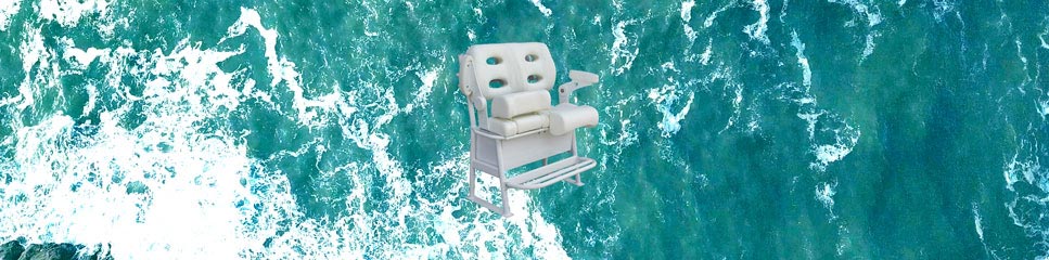 A white leaning post with armrests floating on the ocean with turquoise water and white waves