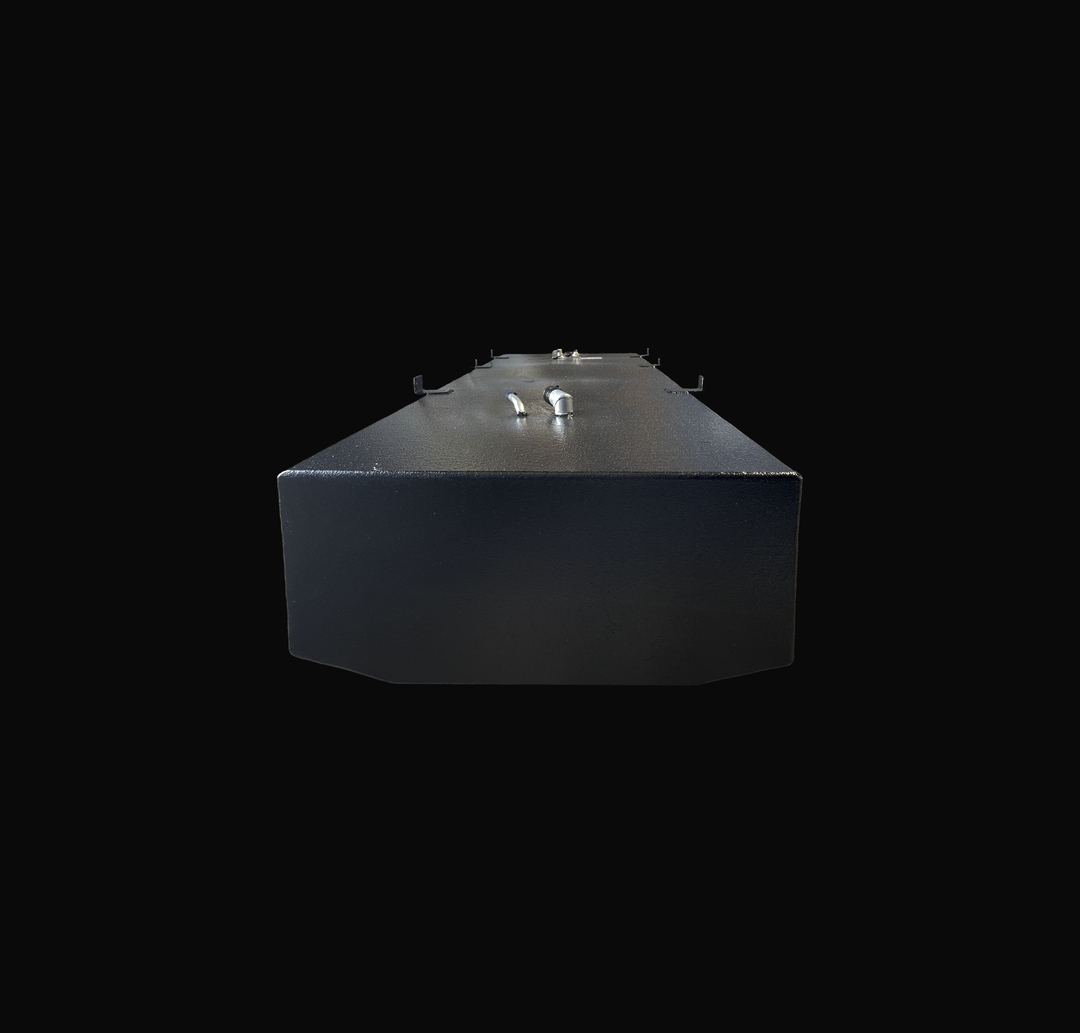 A low-angle, end-profile studio view of a physical, finished black encapsulated Sport Craft 25 WA 1994 OEM replacement marine fuel tank from file image_9a0600.png, isolated against a black background. This perspective captures the alternative end profile, emphasizing the tank's wide cross-section and its specialized bottom deadrise geometry custom-engineered to sit perfectly flush within the vessel's center hull stringer grid. Precision-fabricated from heavy-gauge marine-grade 5052-H32 aluminum, the structu