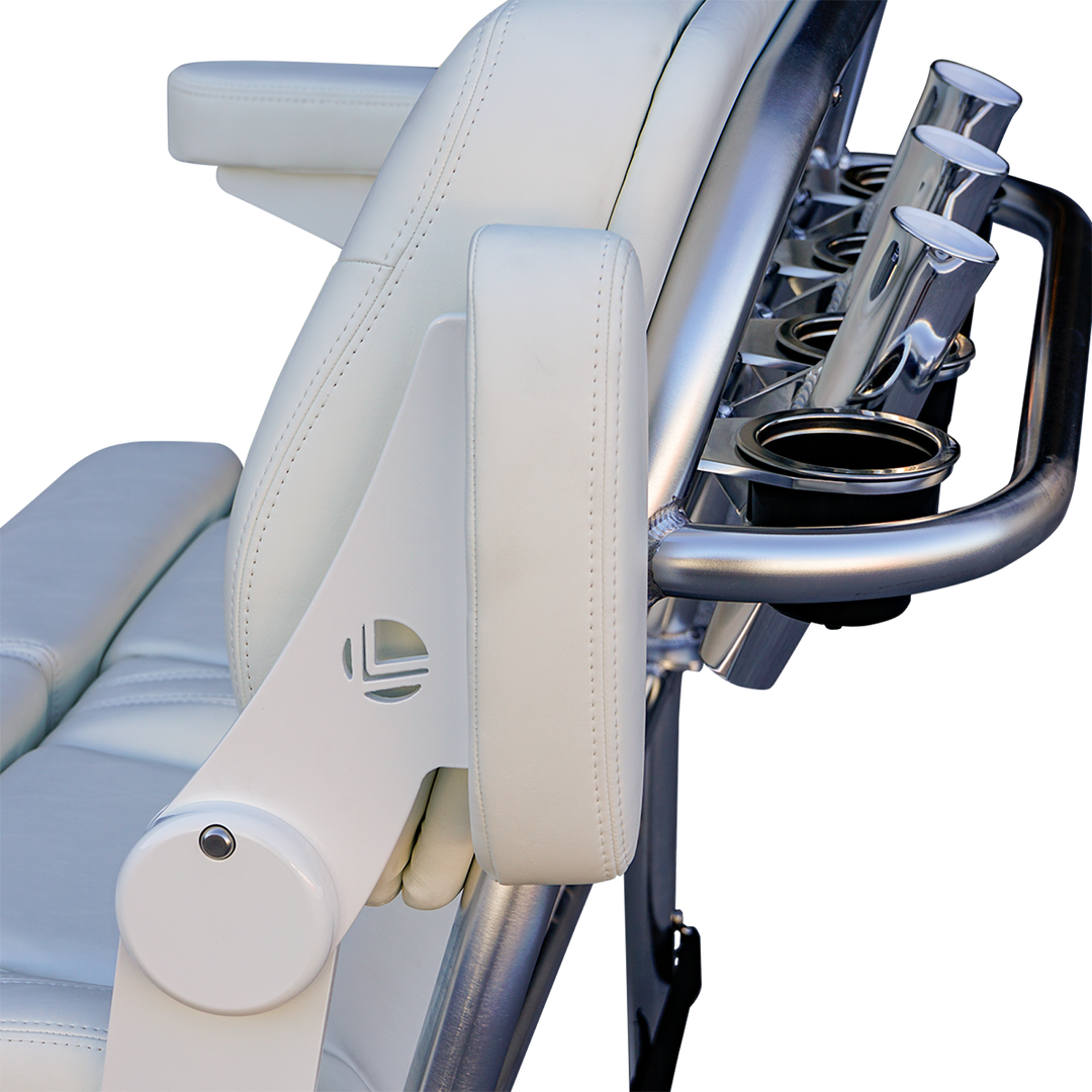 Close-up view of a white leather reclining chair with a sleek metallic armrest featuring cup holders and a modern design