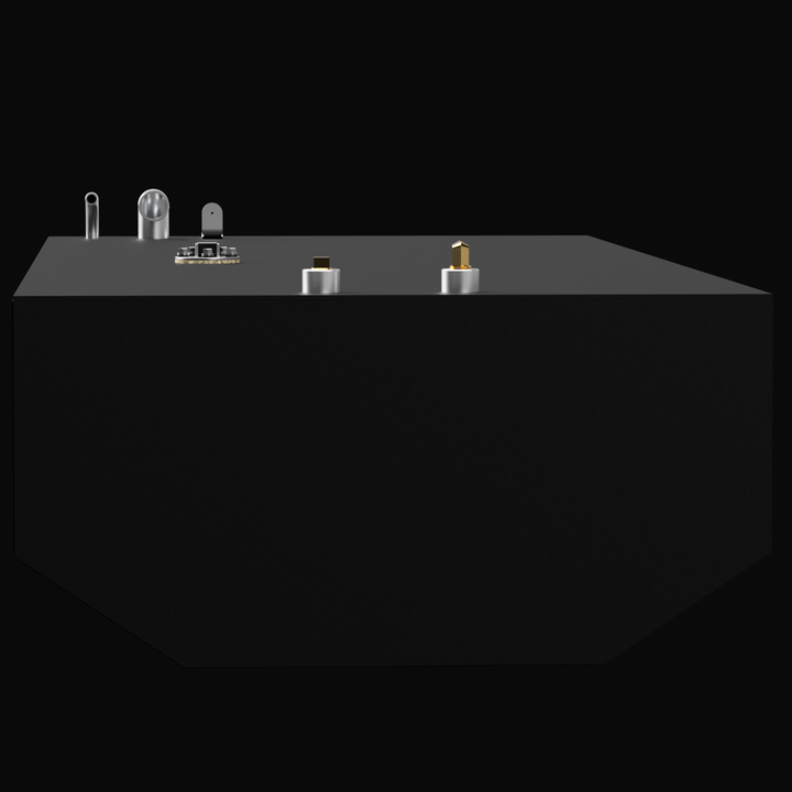 A 3D render showing the profile view of a dark grey boat fuel tank with a V-shaped or faceted bottom. A cluster of silver and brass fittings, including a D-ring and cylindrical cap, is visible on the top edge, against a black background.