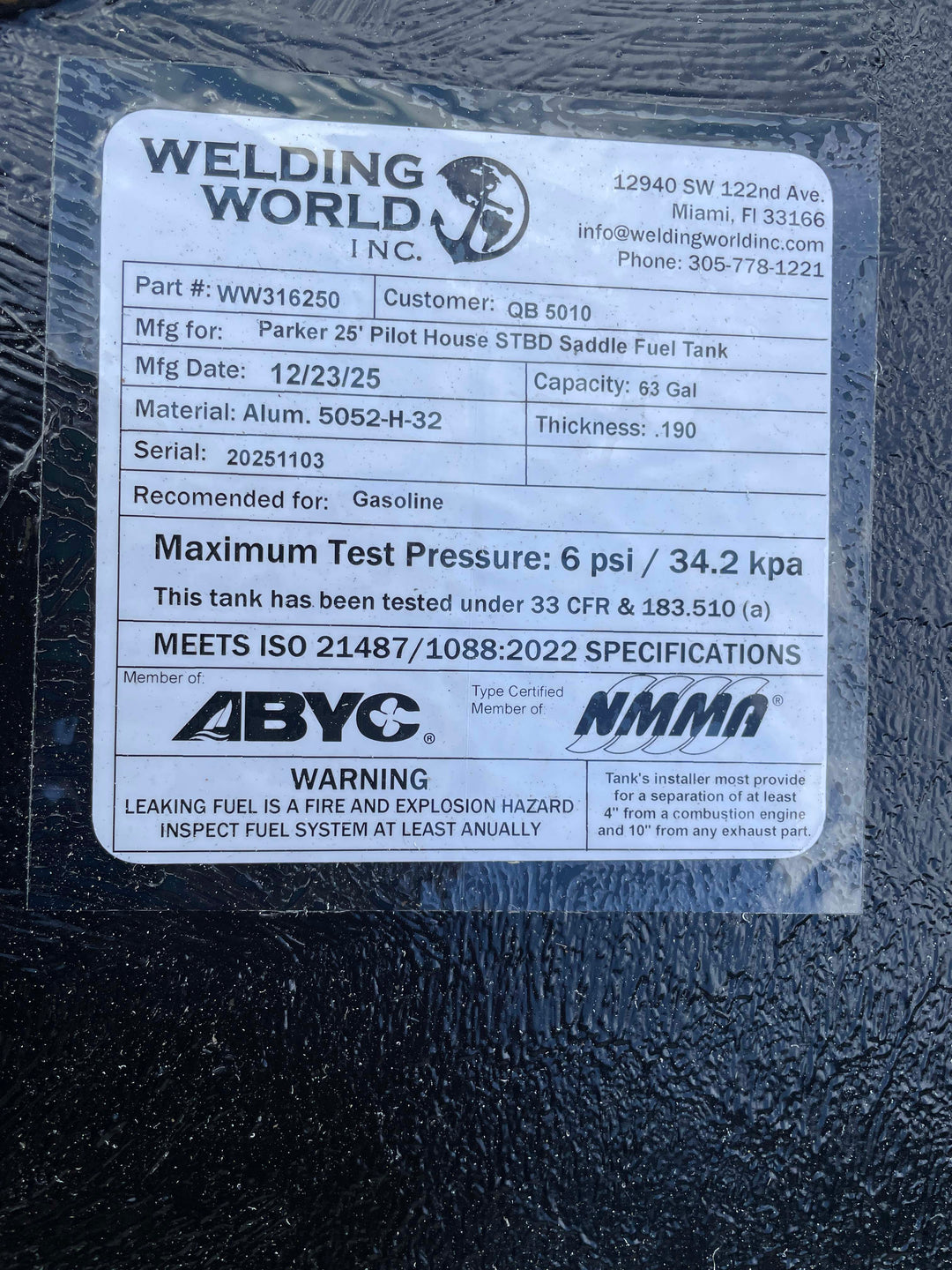 Welding World Inc. label on a fuel tank with specifications and certifications.