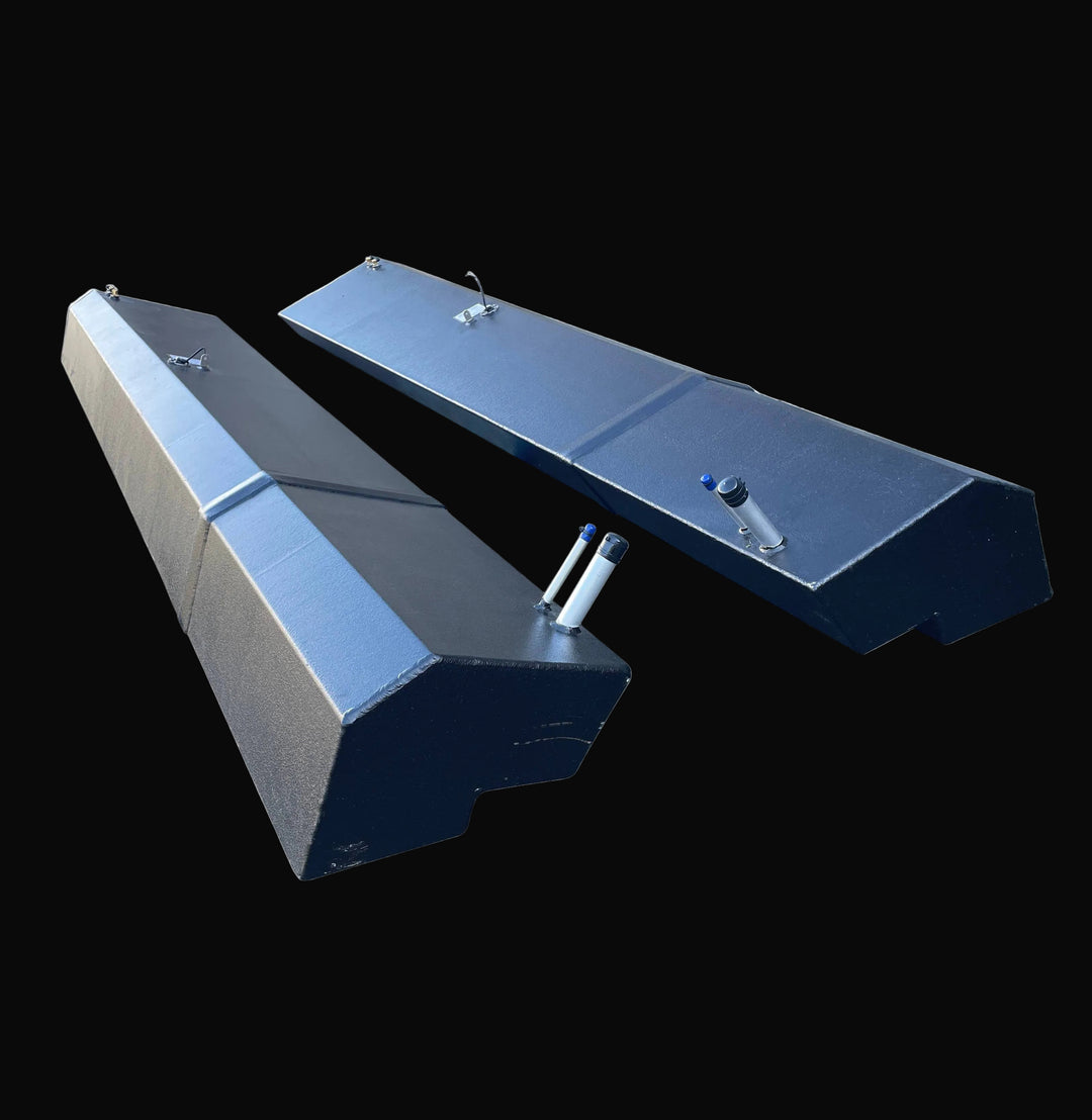 High-angle perspective view of the paired Seacraft 32 replacement fuel tanks, displaying their full longitudinal design. The image emphasizes the mirrored Port and Starboard configuration, black-coated aluminum finish, and precision-welded fill and vent fittings.