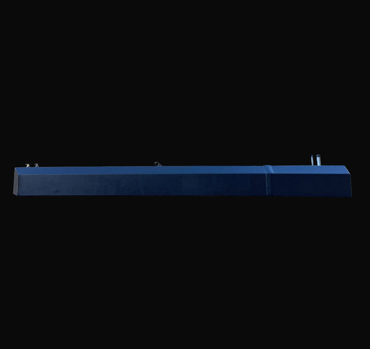 Side elevation view of the Seacraft 32 replacement fuel tank, strictly profiling the stepped hull-contour design. The image captures the full length of the black-coated aluminum unit with fill and vent fittings visible on the top right.