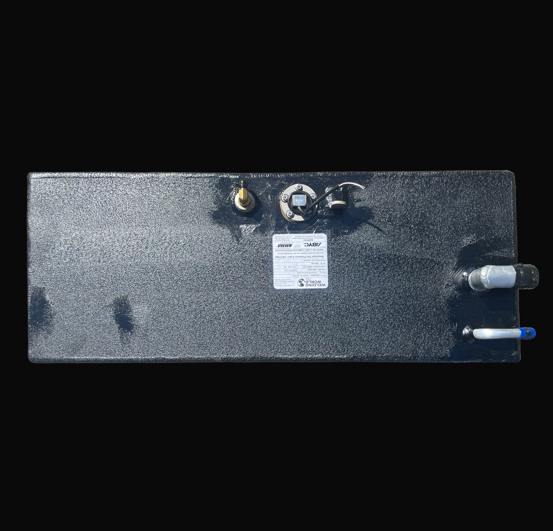 Top-down plan view of a 33-gallon auxiliary fuel tank for an Intrepid Stoner 27, illustrating the placement of the fuel fill, vent port, brass pickup, and KUS sending unit on a protective coal-tar epoxy finish with an ABYC/NMMA certification label.