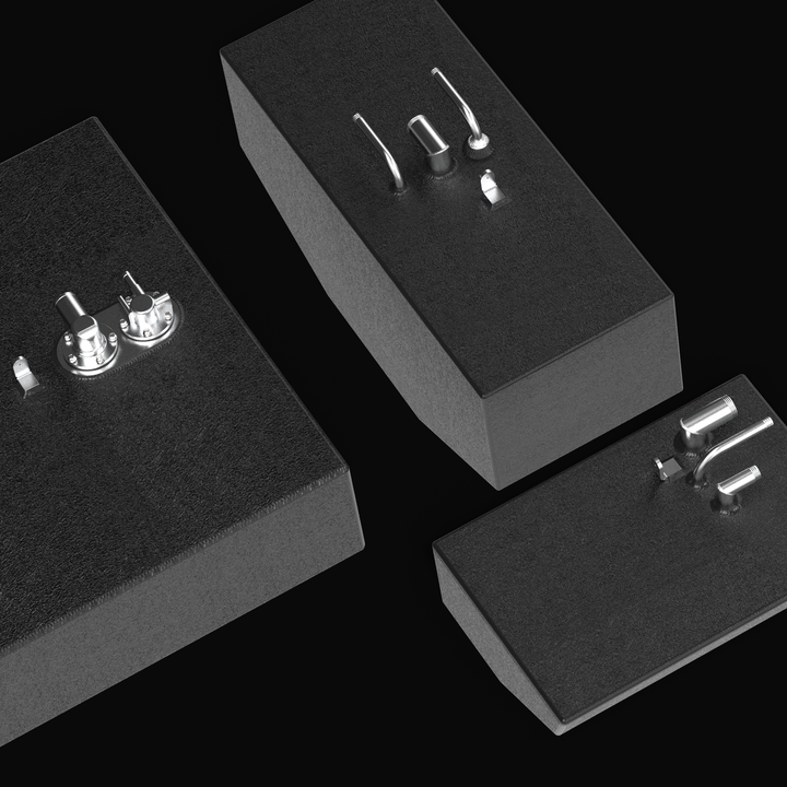 High-angle group view of the Renegade 32 fuel tank components with black protective coating, featuring the main tank fill assembly alongside two angles of the small auxiliary tank.