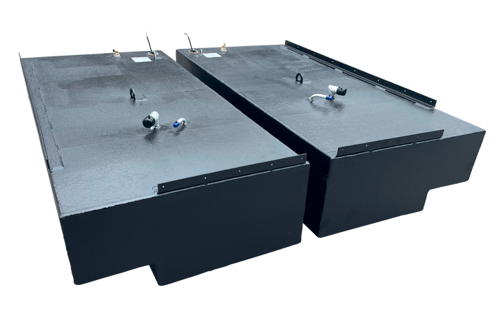 Pair of large, rectangular, black marine fuel tanks (port and starboard) designed for a Stama 2001, each with a 151-gallon capacity. Fittings and inspection ports are visible on the top surface.