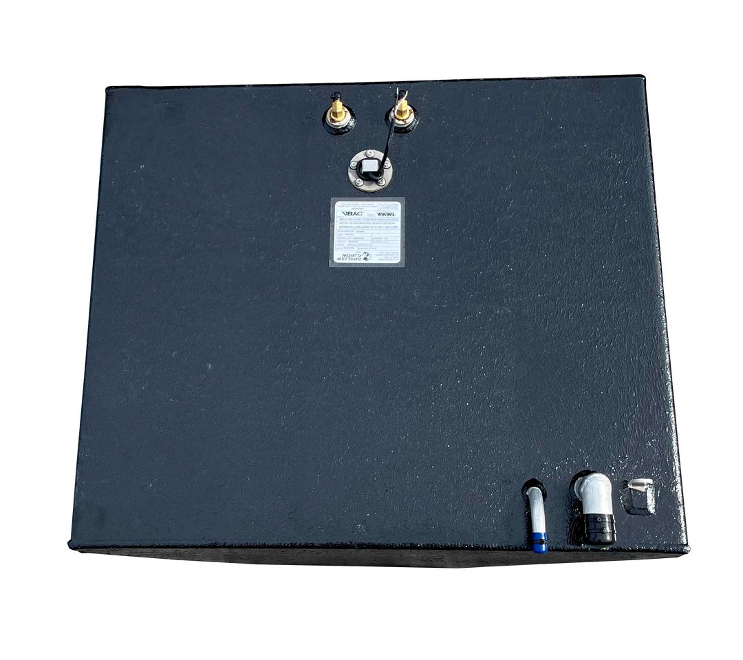 A direct overhead photograph of the center fuel tank, showcasing its square top surface and textured black finish. Integrated hardware includes a central technical label and electrical lead, two brass fittings at the top edge, and a silver-toned fill neck with a vent tube at the bottom right.