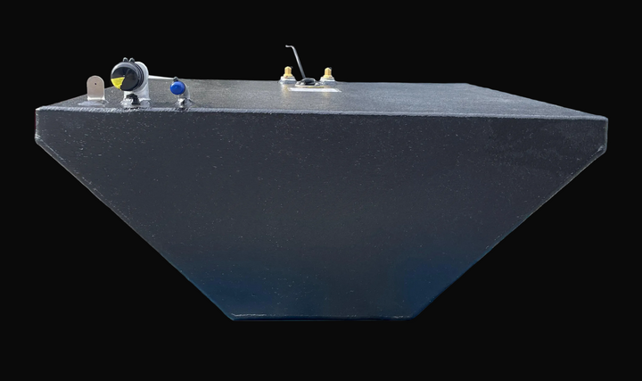 A close-up, end-on profile photograph of a wedge-shaped center fuel tank, highlighting its deep V-shaped bottom profile designed for a boat hull. The flat top surface displays various hardware, including a silver-toned fill neck with a black cap and a smaller blue-capped vent fitting.