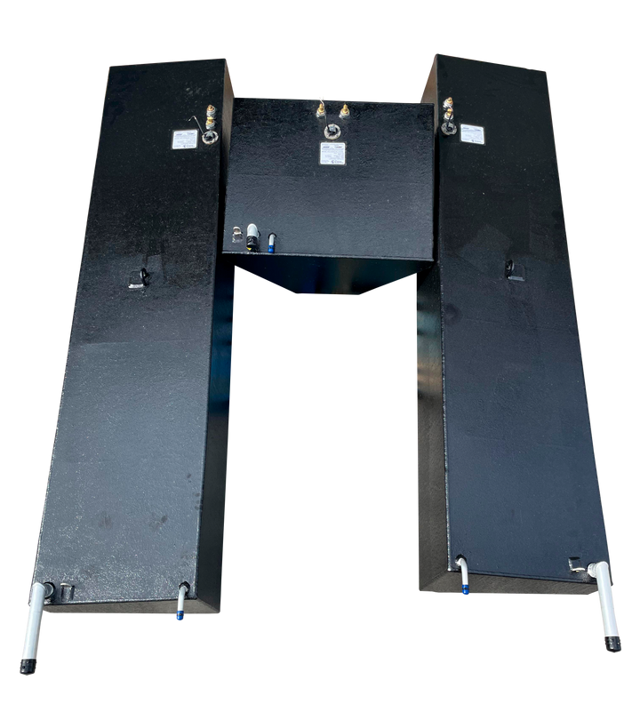 A top-down photograph showcasing the relative layout of three black marine fuel tanks for a Conch 27 boat. Two long side tanks are positioned parallel to each other, flanking the smaller, wedge-shaped center tank located between their rear sections, highlighting the uniform placement of hardware across the entire set.