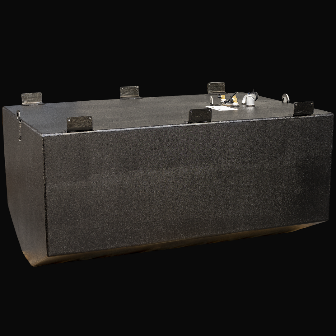 A black rectangular marine fuel tank is shown from a front-left angle with the longer side facing forward. The tank has a flat top surface featuring several welded mounting brackets along the edges. Two circular lifting rings are visible, one on the left side edge and one near the back on the right. The top surface has various fittings and connectors, including a white plastic pipe with a blue tip, brass fittings, and a sensor with black wiring. The bottom edges of the tank are rounded