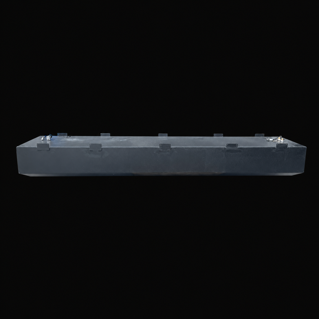 A full side-elevation perspective view of an elongated black Baja 28 1990 replacement marine fuel tank isolated against a black background. This high-capacity 212-gallon center-hull fuel cell showcases an extended low-profile structure featuring precision-welded perimeter mounting tabs distributed evenly along its top edges to secure the tank into the vessel's framing. Precision-fabricated from heavy-gauge marine-grade 5052-H32 aluminum, the entire unit is treated with a textured, anti-corrosive black TarGa