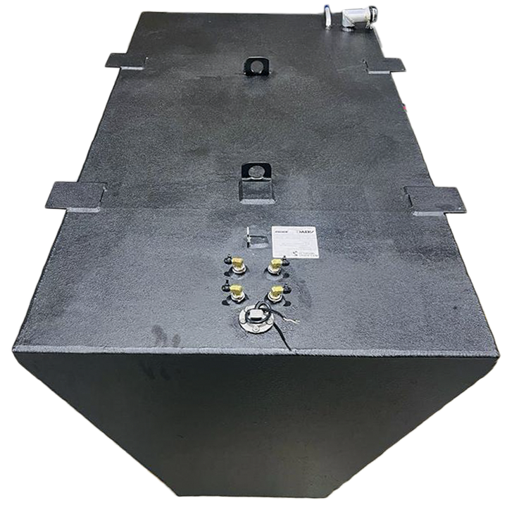 A dark grey, irregularly shaped metal tank with a textured surface is shown from an elevated perspective against a black and grey checkered background. The tank's trapezoidal side and rectangular top are visible, along with various fittings, including nozzles, caps, and what appear to be handles or mounting points, on its upper surface. A small white label is also present on the tank's top