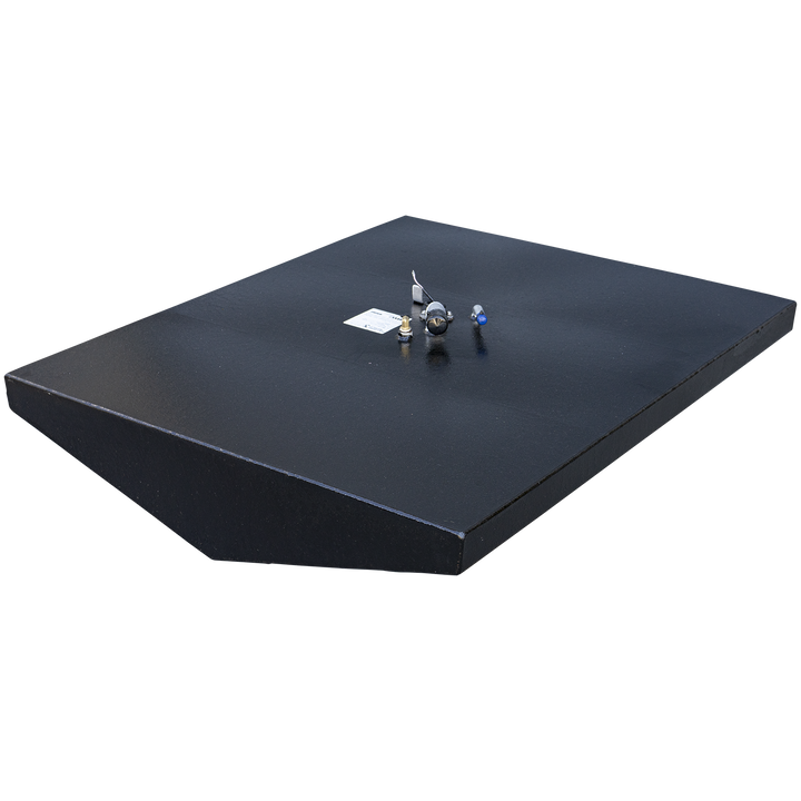 A black-coated boat fuel tank with a tapered shape that is wider at the front and narrower at the rear, designed to fit a specific hull. The tank is viewed from a high three-quarter angle against a checkered background. Its flat top surface features a single, dense cluster of fittings, including a sending unit and valve. The front bottom edge of the tank is V-shaped