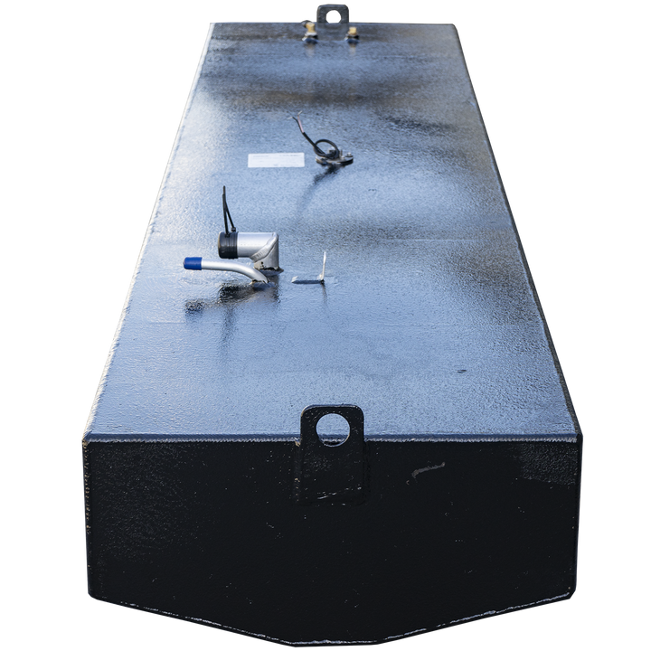117-gallon gross capacity belly fuel tank for the 1995 Boston Whaler Outrage 21'. The matte black aluminum tank features a rectangular profile with a capped blue-handled shutoff valve positioned near the front edge, a central cylindrical sender unit with attached wiring, and a rear-mounted brass return fitting. A white certification label confirms .190″ 5052-H32 marine-grade aluminum construction and 9 psi test rating under 33 CFR § 183.510(a)