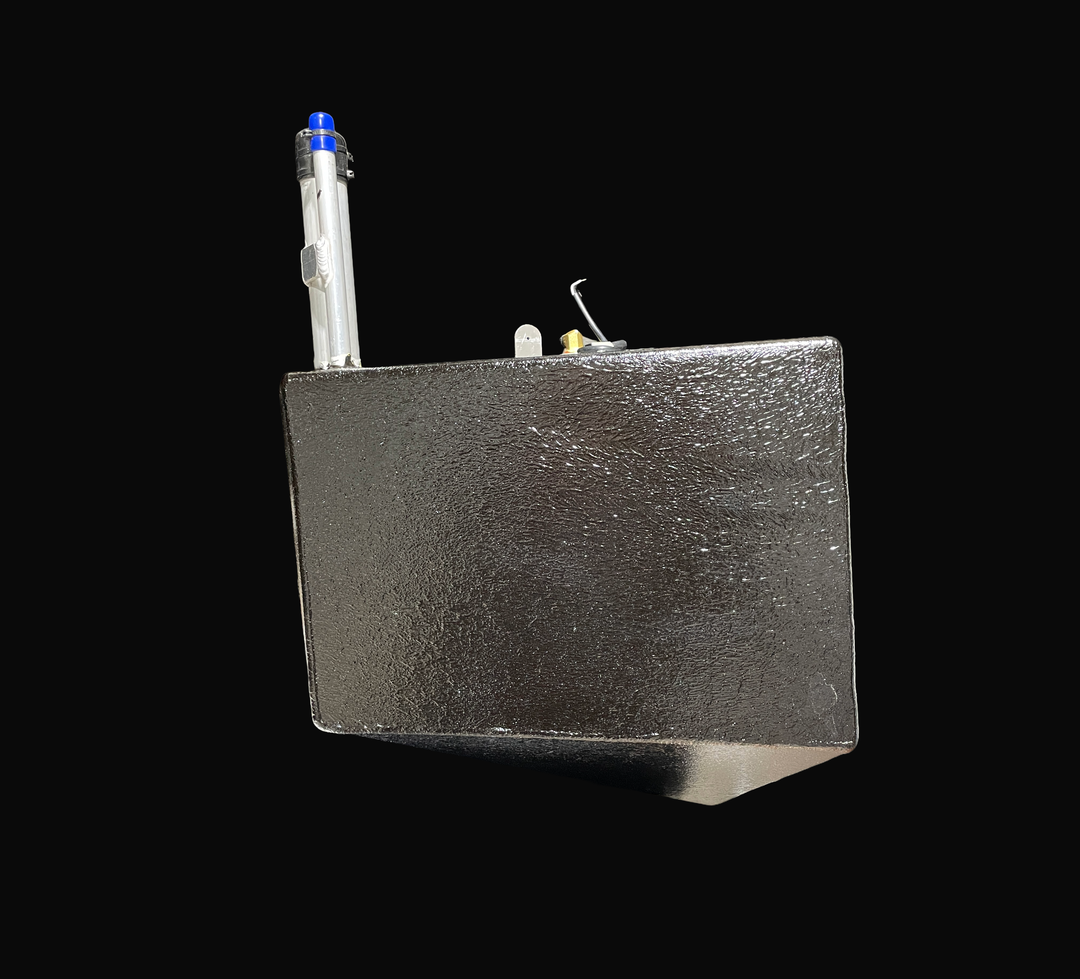 A studio side profile view showcasing the deep-cavity wedge profile of a physical, finished black encapsulated Caribe DL-11 OEM replacement marine fuel tank (11 gal 2016) from file image_aeb7fa.jpg, isolated against a black background. Precision-fabricated from heavy-gauge marine-grade 5052-H32 aluminum, the deep rectangular cell features a tapered bottom deadrise angle designed to sit flush within the hull cavity of the 2016 Caribe DL-11 tender. The entire main body is fully encapsulated in a protective, t