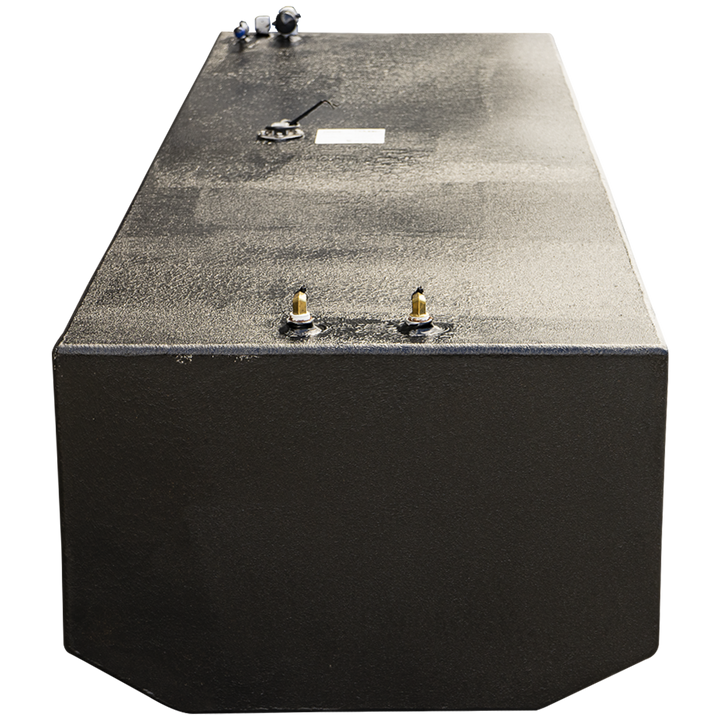 An end-on perspective view of a large, rectangular marine fuel tank with a textured black coating. The tank's front profile shows angled bottom corners. Looking down the length of the tank, various fittings are visible on the top surface: two brass fuel line connections are prominent in the foreground, followed by a fuel sending unit access plate in the middle, and additional fittings further in the background.