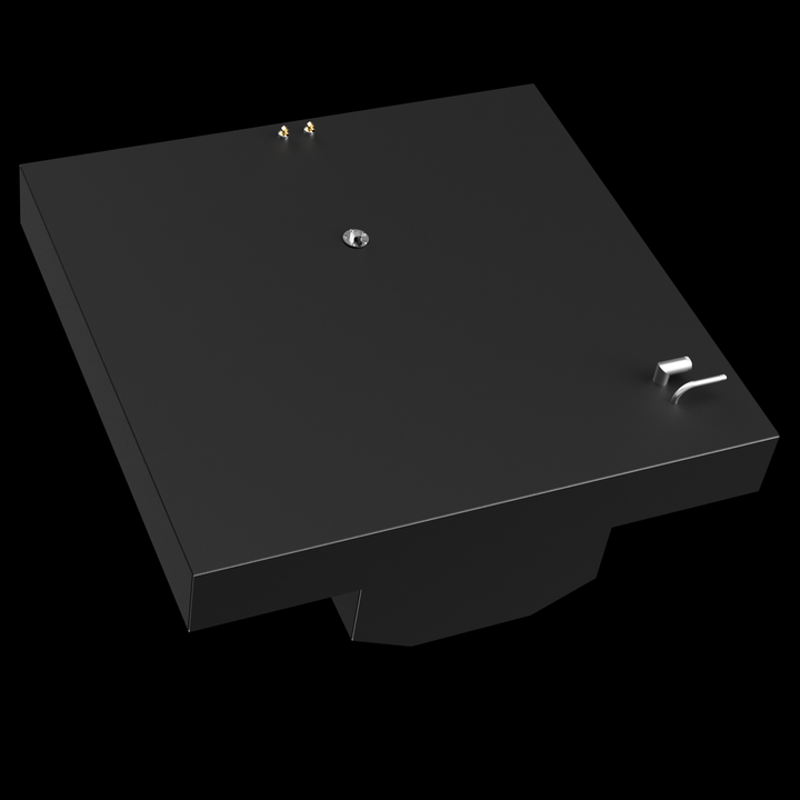 A dark gray, rectangular fuel tank with an irregular, stepped cutout on its underside. The top surface of the tank features two small golden posts, a central circular fitting, and a curved pipe with a rectangular base