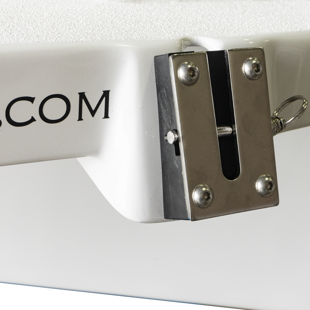 Close-up of a white Apex Mk. II twin engine bracket featuring a metal attachment point, with the text "APEXCOM" visible on the bracket's surface. The bracket is designed for secure mounting and stability