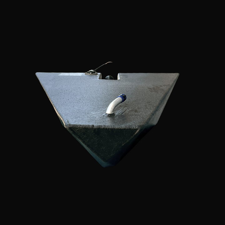 A studio head-on front perspective view looking down the forward apex of a physical, finished black encapsulated Dolphin Skiffs 16 OEM replacement marine fuel tank (25 gal 1998) from file image_43343f.jpg, isolated against a black background. Precision-fabricated from heavy-gauge marine-grade 5052-H32 aluminum, the custom-contoured bow-wedge body is fully encapsulated in a protective, textured black TarGard epoxy coating to resist severe saltwater pitting and bilge moisture decay. Foreground deck hardware f