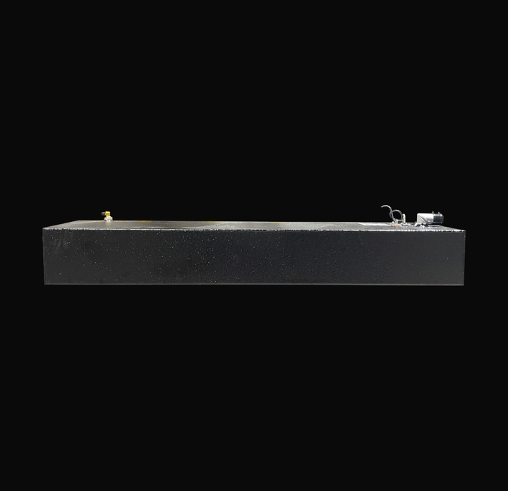 An eye-level studio side profile view displaying the full length of a physical, finished black encapsulated Eagle 17 OEM replacement marine fuel tank (29 gal 2000) from file image_495a7c.png, isolated against a black background. Precision-fabricated from heavy-gauge marine-grade 5052-H32 aluminum, the long low-profile rectangular body is fully encapsulated in a protective, textured black TarGard epoxy coating to resist severe saltwater pitting and bilge corrosion. Visible top deck hardware includes a left-m