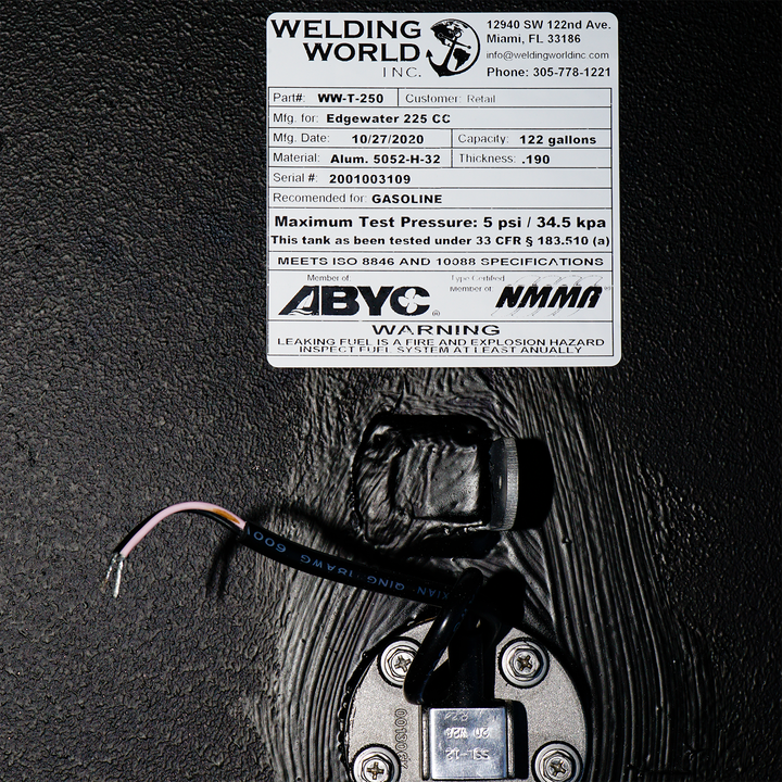 Close-up of the OEM replacement belly fuel tank for Edgewater 225 CC, featuring a capacity of 122 gallons. The tank is labeled with specifications including the model number (WT-250), date of manufacture (10/27/2020), material (aluminum), and maximum test pressure (5 psi / 34.5 kPa). A warning label indicates that the tank is designed for gasoline