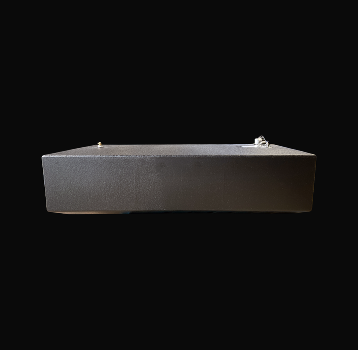 An eye-level studio side profile view displaying the opposite full length of a physical, finished black encapsulated Edgewater 24 OEM replacement marine fuel tank (110 gal) from file image_f71a86.jpg, isolated against a black background. Precision-fabricated from heavy-gauge marine-grade 5052-H32 aluminum, the low-profile rectangular body is fully encapsulated in a protective, textured black TarGard epoxy coating to resist severe saltwater pitting and bilge moisture decay. Top deck hardware features a forwa