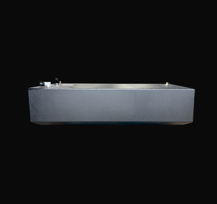 An eye-level studio side profile view displaying the full length of a physical, finished black encapsulated Edgewater 24 OEM replacement marine fuel tank (110 gal) from file image_9cc411.jpg, isolated against a black background. Precision-fabricated from heavy-gauge marine-grade 5052-H32 aluminum, the long low-profile V-bottom body is fully encapsulated in a protective, textured black TarGard epoxy coating to resist severe saltwater pitting and bilge corrosion. Visible top deck hardware includes a left-moun