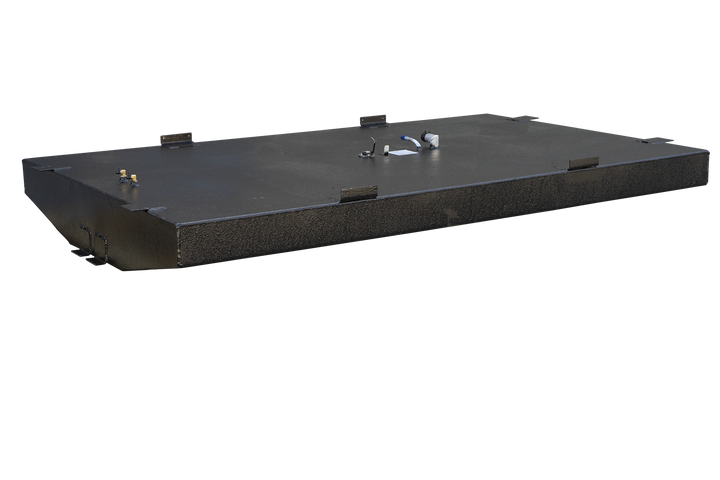 A wide, black, textured fuel tank with an irregular shape, featuring a curved front edge and two rectangular cutouts on its underside. The top surface of the tank is equipped with various fittings, including small cylindrical components, a circular fuel level sender with wires, a white label, and a bent pipe with a blue cap