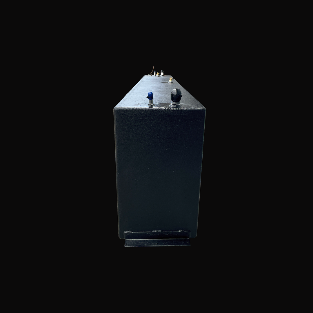 A front profile view of the Fiesta Vee Rinker 340 replacement fuel tank, highlighting its slim, narrow width profile and a bottom-mounted installation flange. The tank is completely coated in a premium, protective black TarGard epoxy finish for superior resistance against fuel corrosion and the marine environment. Top-mounted hardware is visible stretching down the length of the deck, including precision fittings for the fuel fill and vent lines. Built by Welding World from heavy-duty .190" marine-grade alu