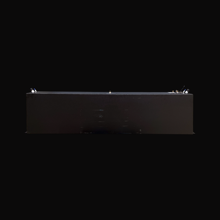 A full side elevation view of the opposite side of the Fiesta Vee Rinker 340 replacement marine fuel tank, showcasing its clean, continuous rectangular profile and protective black TarGard epoxy finish. This perspective highlights the low-profile mounting flanges extending along the bottom edges for secure hull installation. The top deck exhibits the clean alignment of marine-grade hardware, including fuel fill and vent ports on the left, a center brass fitting, and the fuel sending unit assembly on the rig
