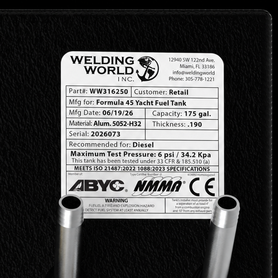 Close-up top-deck hardware layout view of a black Formula 45 Yacht Saddle diesel replacement marine fuel tank. The image focuses on a manufacturer specification data placard listing part number WW316250, customer type Retail, and a manufacturing date of 06/19/26. Fabricated from heavy-gauge marine-grade 5052-H32 aluminum with a thickness of .190, the 175-gallon capacity saddle tank body is fully encapsulated in a textured, anti-corrosive black TarGard epoxy coating. Two raw aluminum connection pipes emerge 
