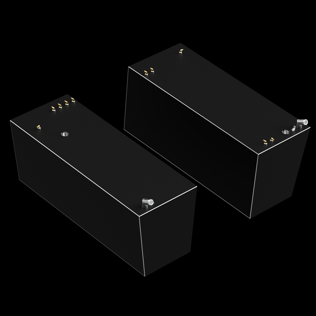 Two dark gray, rectangular fuel tanks are shown against a black background. Both tanks feature multiple small brass-colored and silver-colored fittings on their top surfaces, and a thin white outline runs along the top edges of both tanks. The tanks are positioned at an angle relative to each other