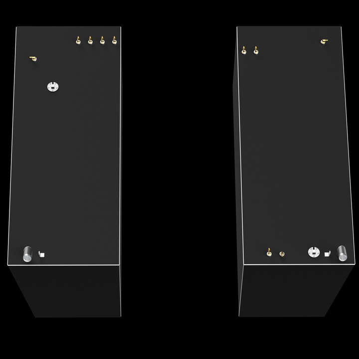 Two dark gray, rectangular fuel tanks are shown vertically against a black background, separated by a dark space. Both tanks have thin white outlines along their edges and feature several small brass-colored and silver-colored fittings on their top surfaces