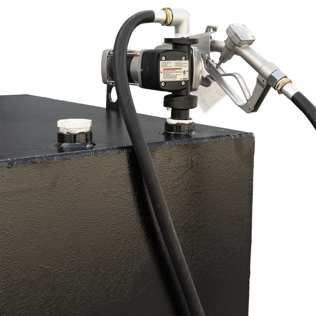A close-up of a black, textured fuel tank with a silver threaded pipe and an attached cap via a chain on the top right. A white tube connected to a brass elbow fitting is on the top left. A white label from Welding World Inc. is visible on the side, showing details like Part# WW-T-250, Mfg Date 07/27/2022, Material Alum. 5052-H-32, and Serial# 2022476