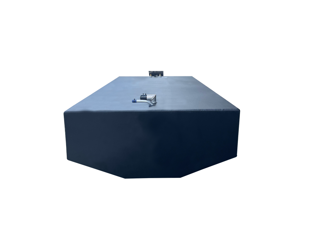 A low-angle photo of a large, wide, dark blue boat fuel tank with faceted corners. The top surface shows two clusters of fittings, including a prominent silver and blue pipe connection, against a transparent checkerboard background.