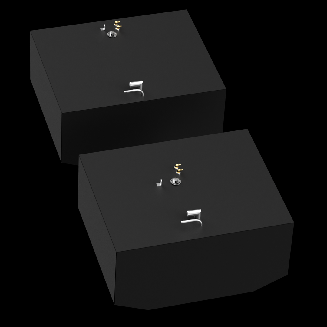Two dark grey, rectangular fuel tanks are shown from an elevated, angled perspective against a black background with subtle white dots. Each tank has various golden and silver-colored fittings on its top surface, including pipes and valves. The tanks have angled bottom corners