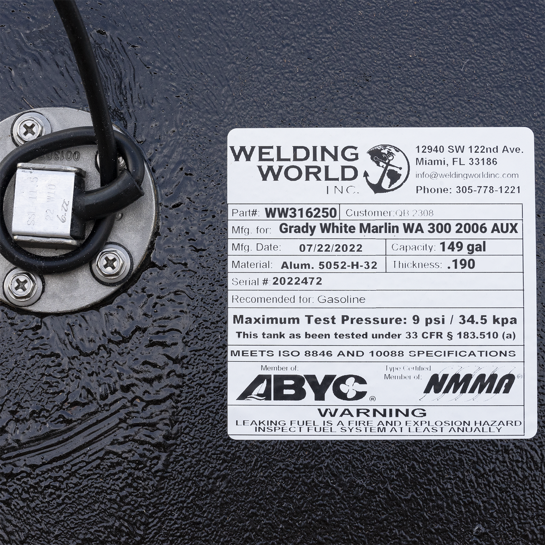 Welding World Inc. certification label for a 2006 Grady-White Marlin 300 auxiliary fuel tank, showing a 149-gallon capacity, .190" thickness, and 5052-H-32 aluminum material. Includes ABYC and NMMA compliance logos and USCG 33 CFR § 183.510(a) test standards.