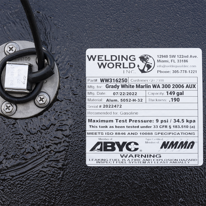 Welding World Inc. certification label for a 2006 Grady-White Marlin 300 auxiliary fuel tank, showing a 149-gallon capacity, .190" thickness, and 5052-H-32 aluminum material. Includes ABYC and NMMA compliance logos and USCG 33 CFR § 183.510(a) test standards.