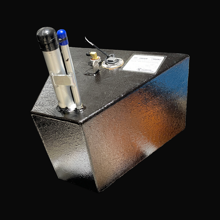 A studio perspective view of a physical, finished black encapsulated Grady-White Overnighter 20 OEM replacement marine fuel tank (65 gal) from file image_af24b5.jpg, isolated against a black background. Precision-fabricated from heavy-gauge marine-grade 5052-H32 aluminum, the custom deep-cavity cell is fully encapsulated in a protective, textured black TarGard epoxy coating to resist severe saltwater pitting and bilge corrosion across models ranging from 204-C, 205, 206, to 206-C (1975–1992). The top deck d