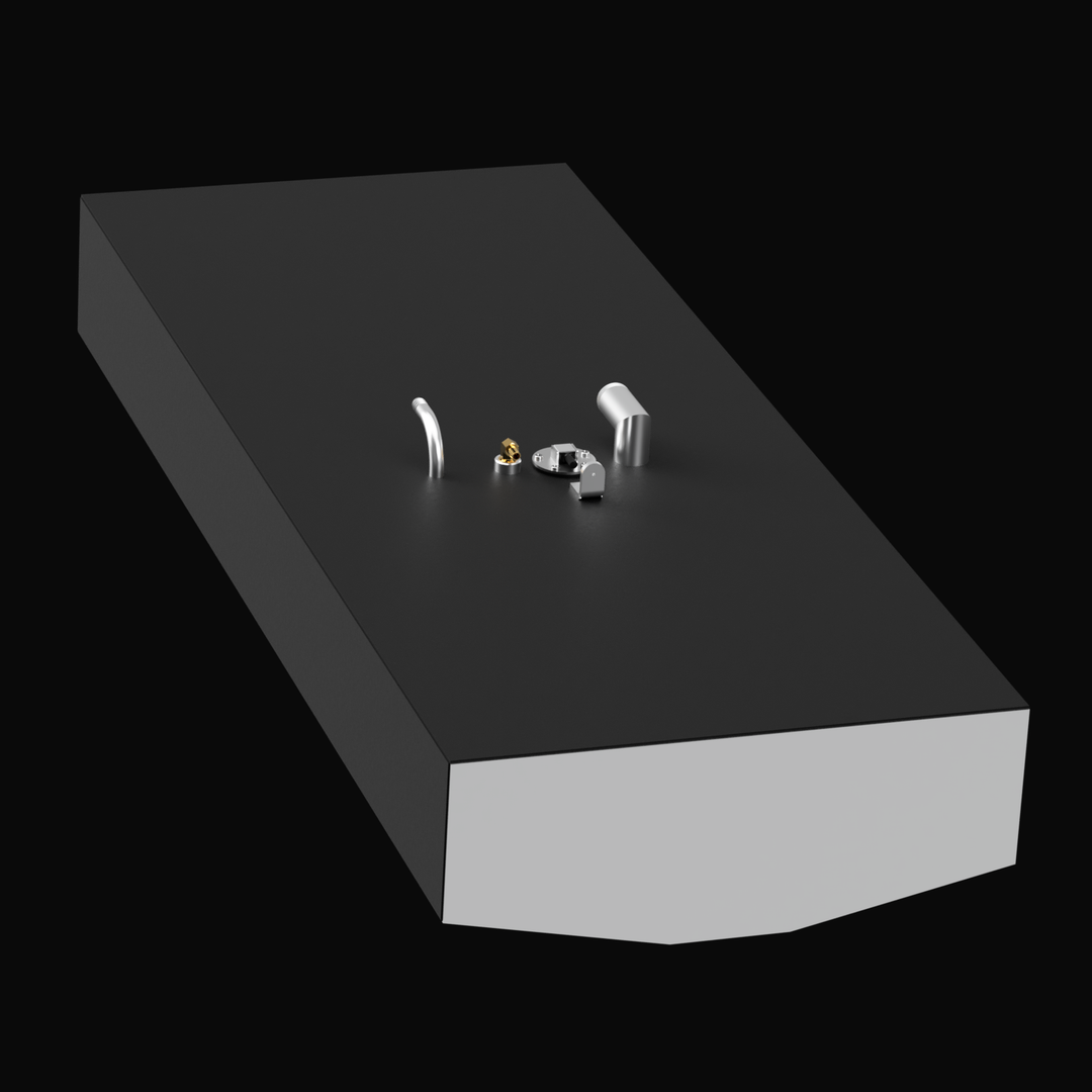 3D rendered black marine fuel tank with beveled front corners shown from a high diagonal angle on a black background. The tank top features several fittings including a short silver vent pipe, a round silver cap, a brass fitting, and two small white fittings clustered near the center