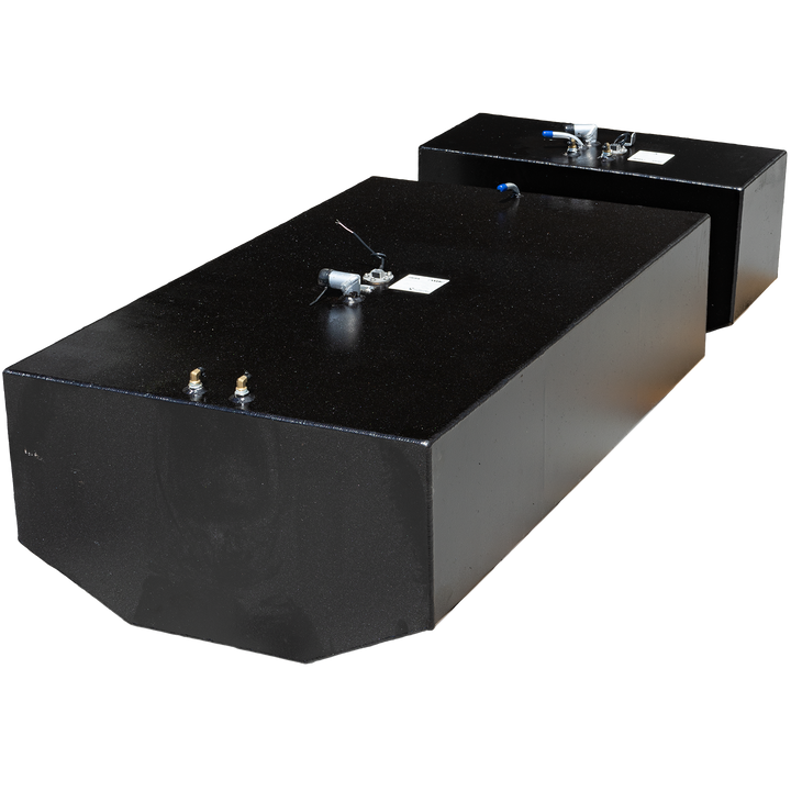 Two black, rectangular fuel tanks, of different sizes, are shown on a black and grey checkered background. Both tanks have various fittings on their top surfaces