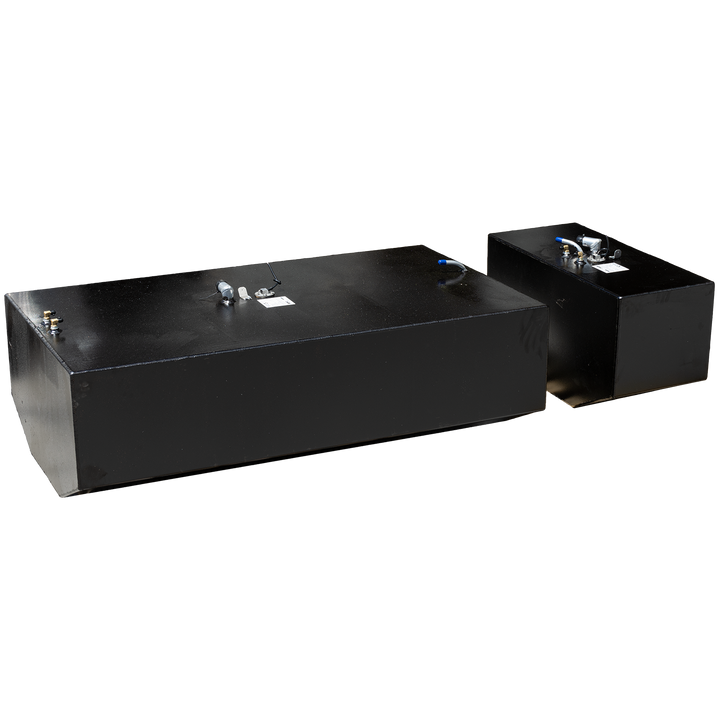 Two black fuel tanks, one larger in the foreground and one smaller in the background, are angled against a black and grey checkered pattern. Both tanks feature various metallic fittings on their top surfaces 