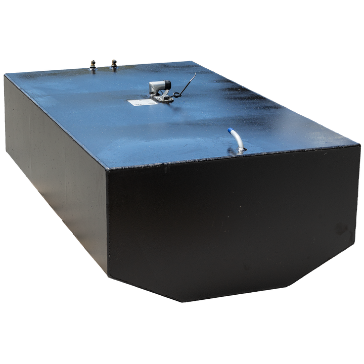 A black, rectangular fuel tank with multiple metal fittings on its top surface, including two brass-colored valves, a silver-colored pump, and a white tube with a blue tip. The tank is positioned against a black and grey checkered background