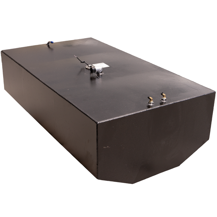 A black, rectangular fuel tank with multiple metal fittings on its top surface, including two brass-colored valves, a silver-colored pump, and a white tube with a blue tip. The tank is positioned against a black and grey checkered background